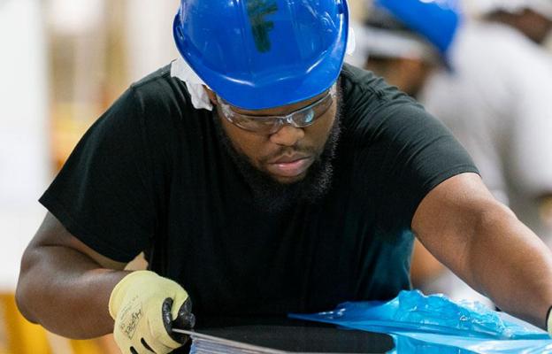 Man working with metal part