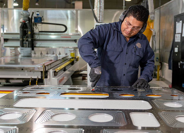 Man working on sheet metal