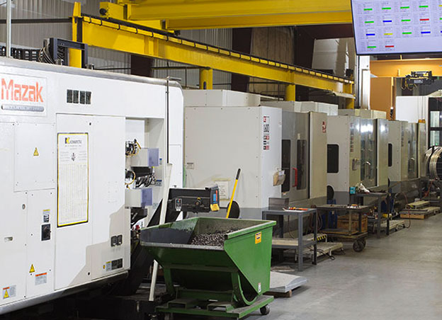 Man operating a CNC machining tool