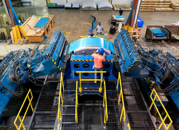Two men working at L-1500 machine