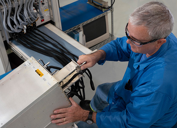 Man assembling electronic components
