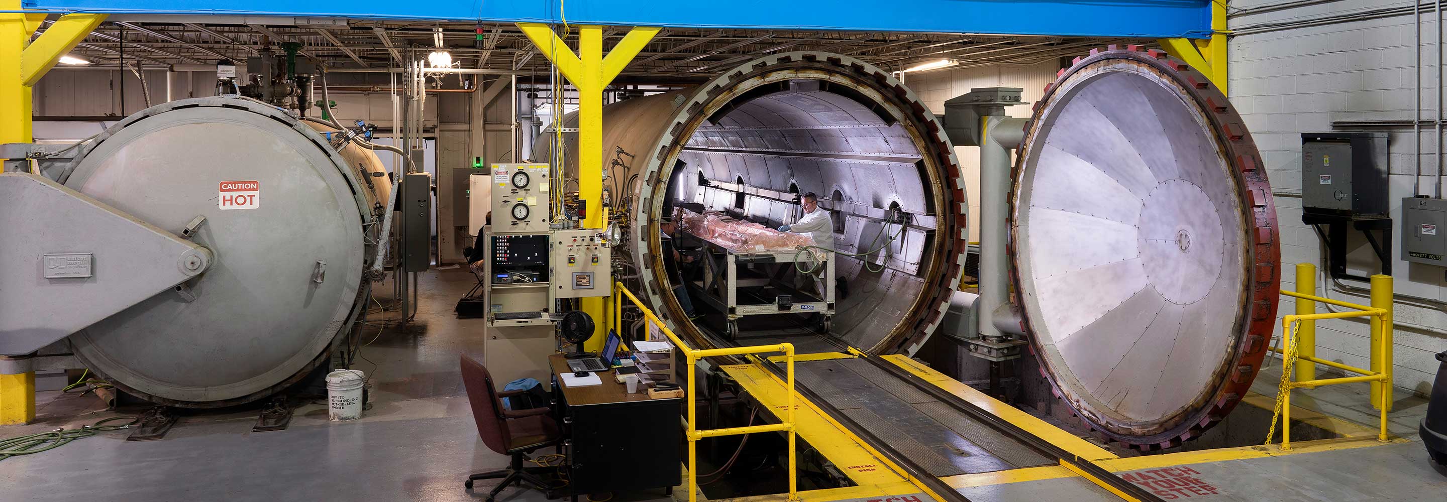 Man working inside large autoclave