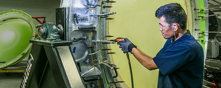 Man riveting large bulkhead