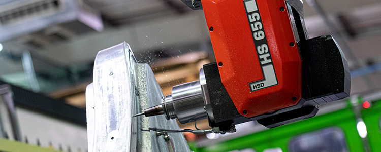 Close up of drill applied to metal object