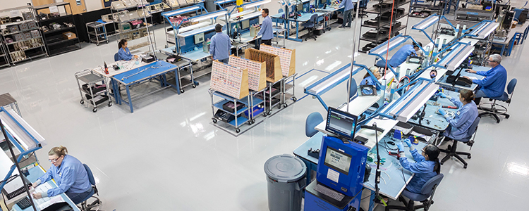 Overhead shot of factory floor with people working at desks