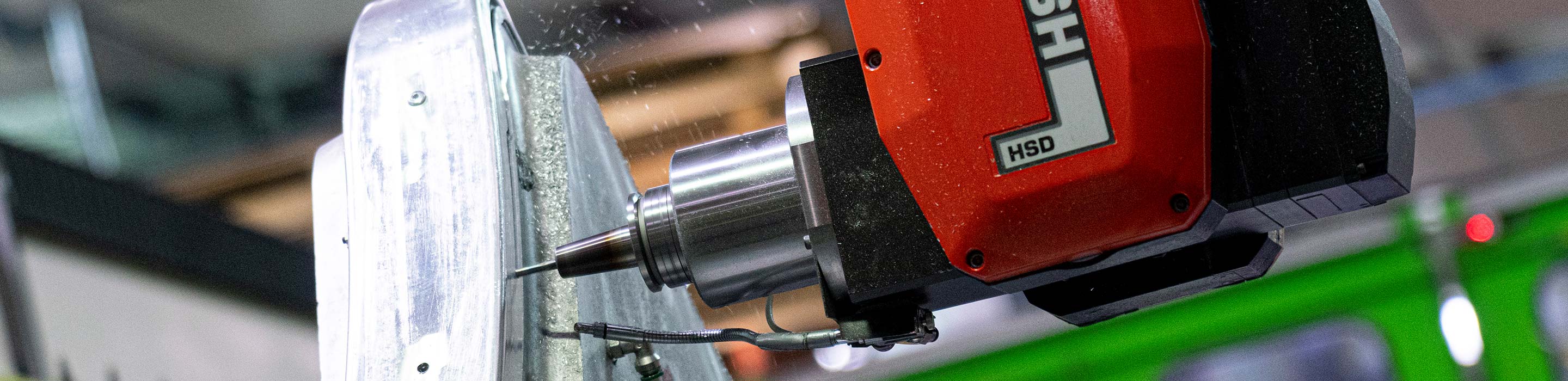 Close up of drill applied to metal object