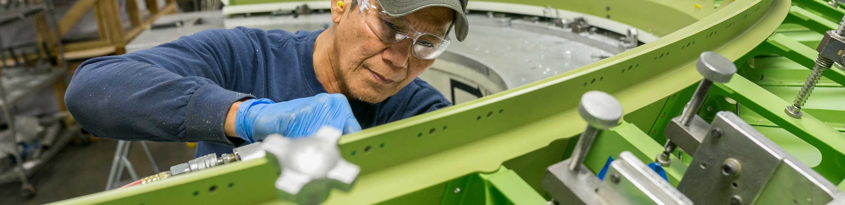 Man working on interior of bulkhead assembly